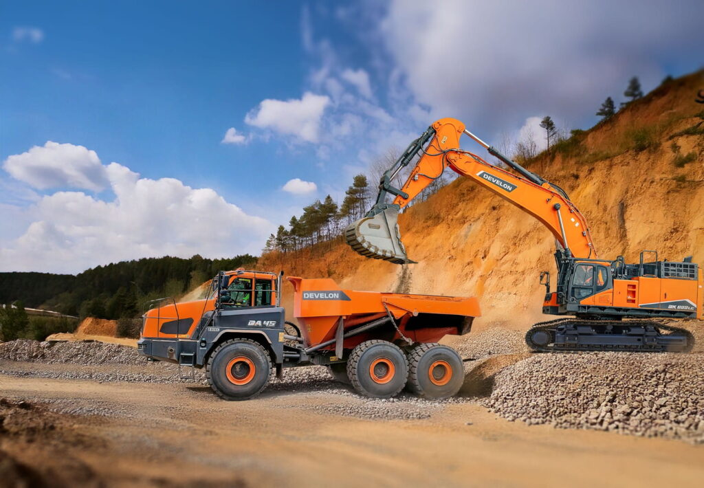 develon excavator loading an develon articulated dumptruck on a construction site