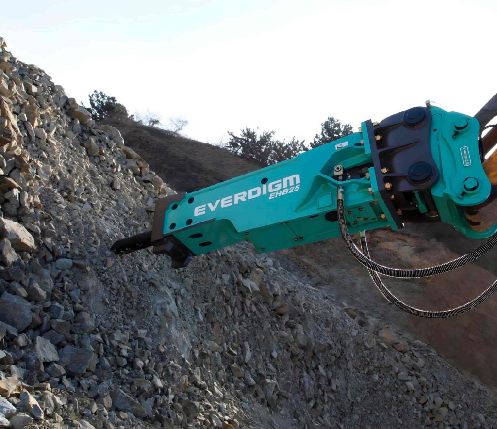 Develon excavator with Everdigm attachment working on rocky terrain, representing high-performance construction machinery in South Africa