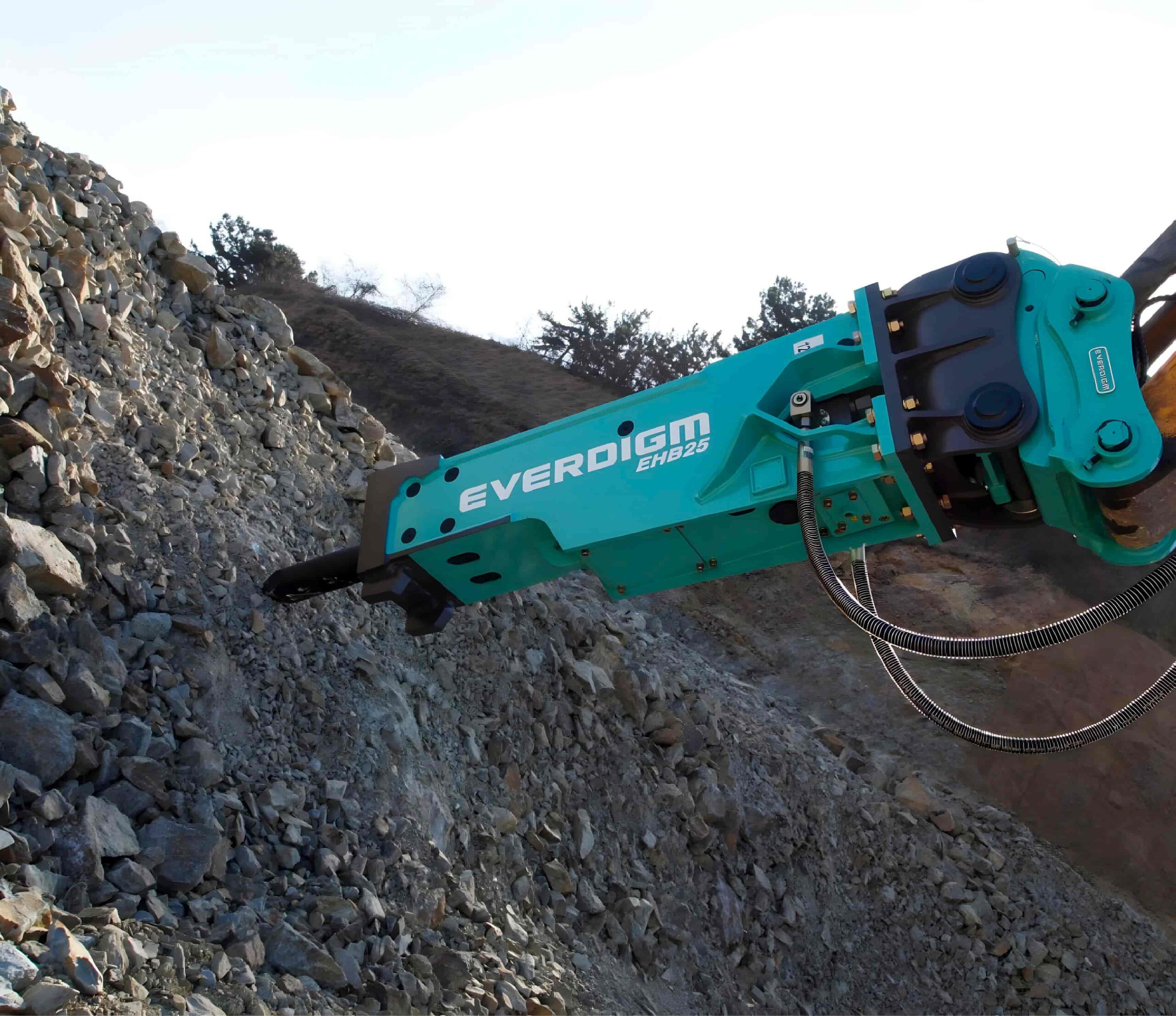 Develon excavator with Everdigm attachment working on rocky terrain, representing high-performance construction machinery in South Africa